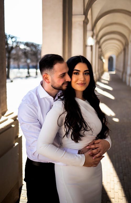 Man in Shirt Hugging Woman