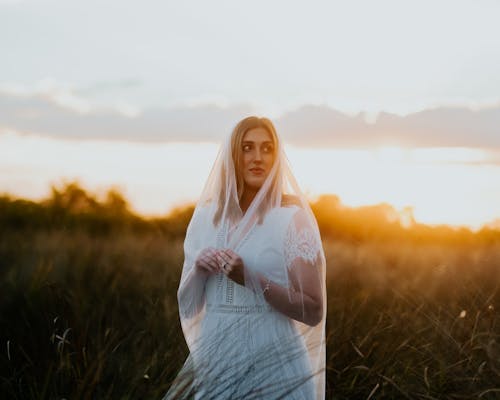 Bride in Wedding Dress at Sunset