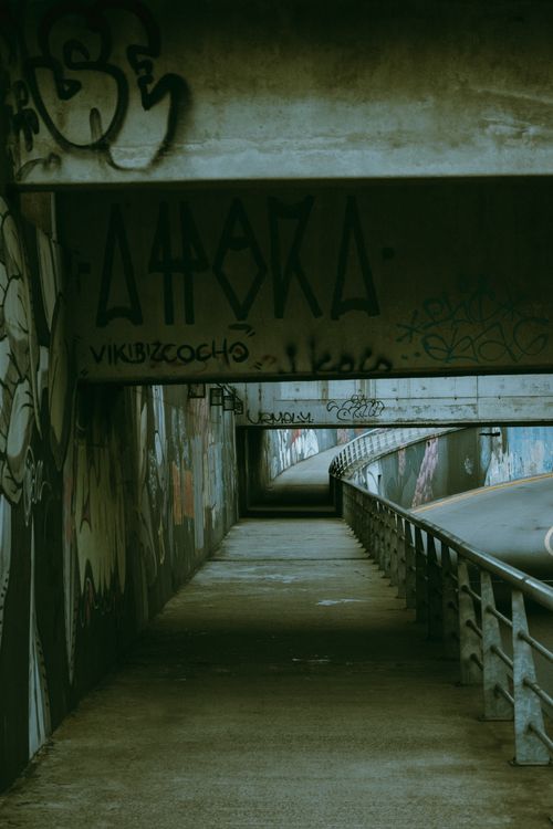 Free Explore the gritty urban tunnel adorned with graffiti in Buenos Aires, Argentina. Stock Photo