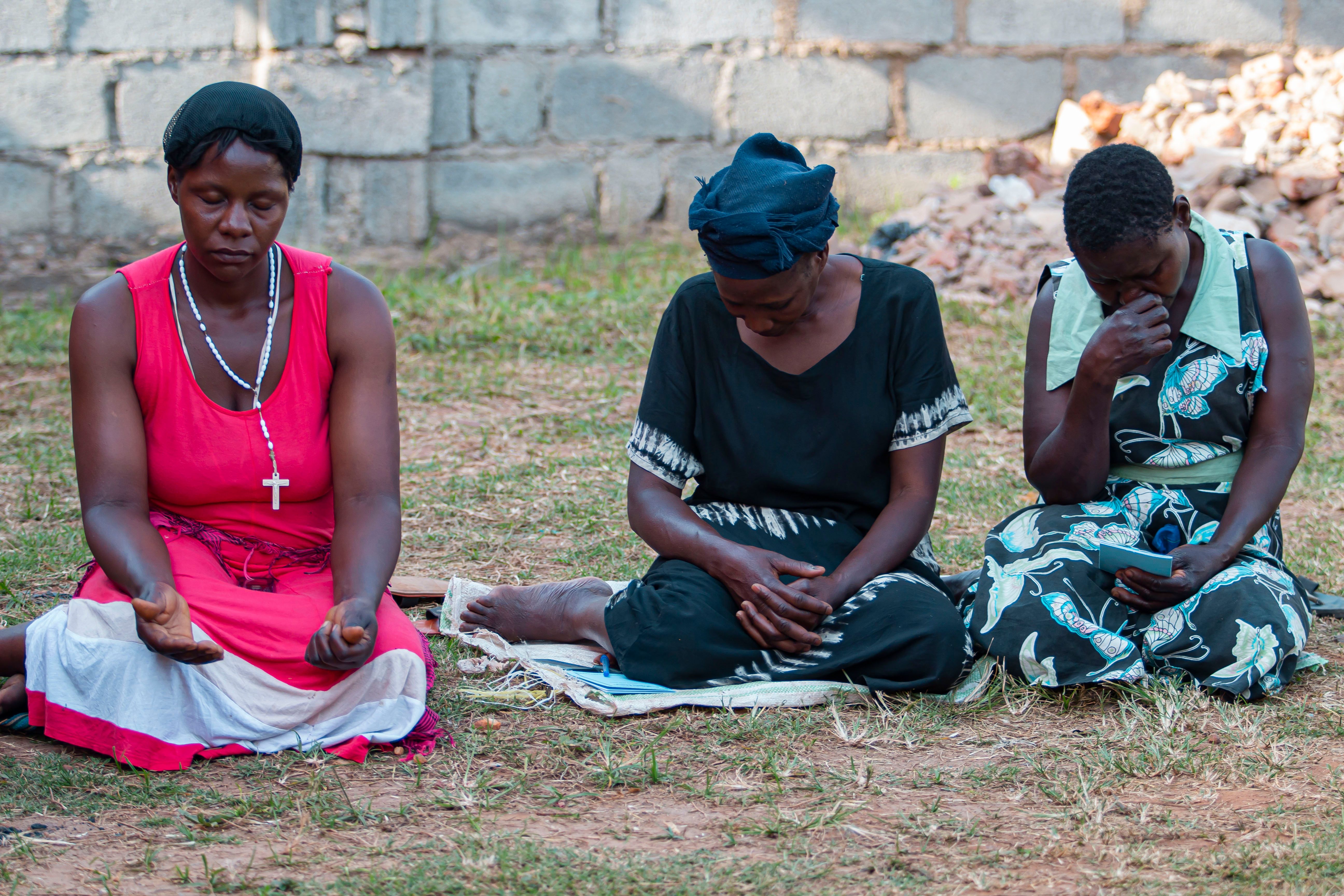 Women Sitting and Praying · Free Stock Photo