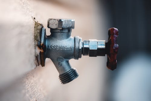 Close up of Metal Faucet on Wall