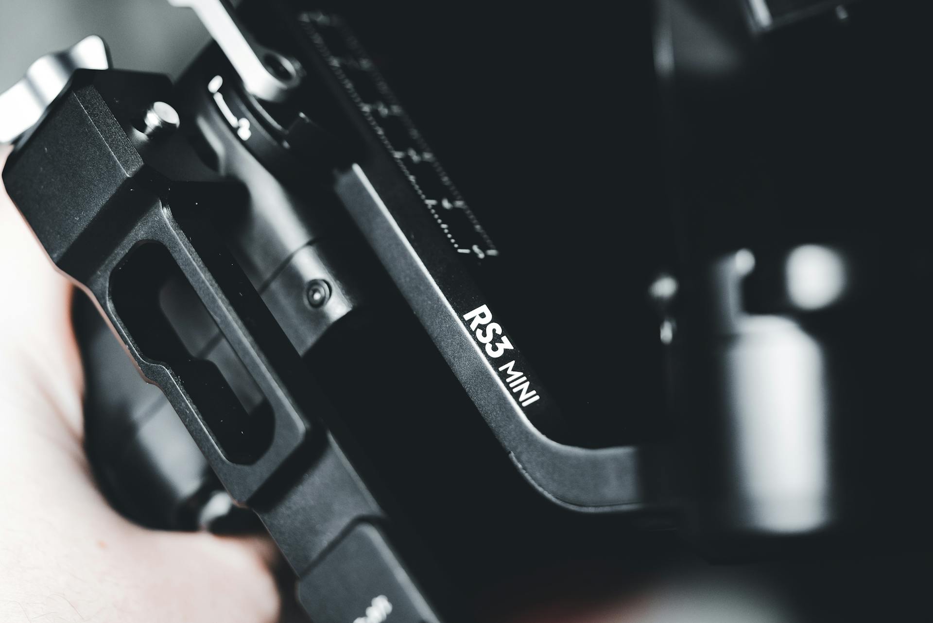 Macro shot highlighting details of a modern RS3 Mini electronic device in black.
