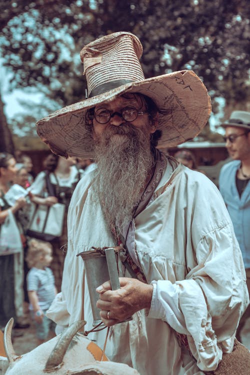 Man with Gray Beard Posing in Hat