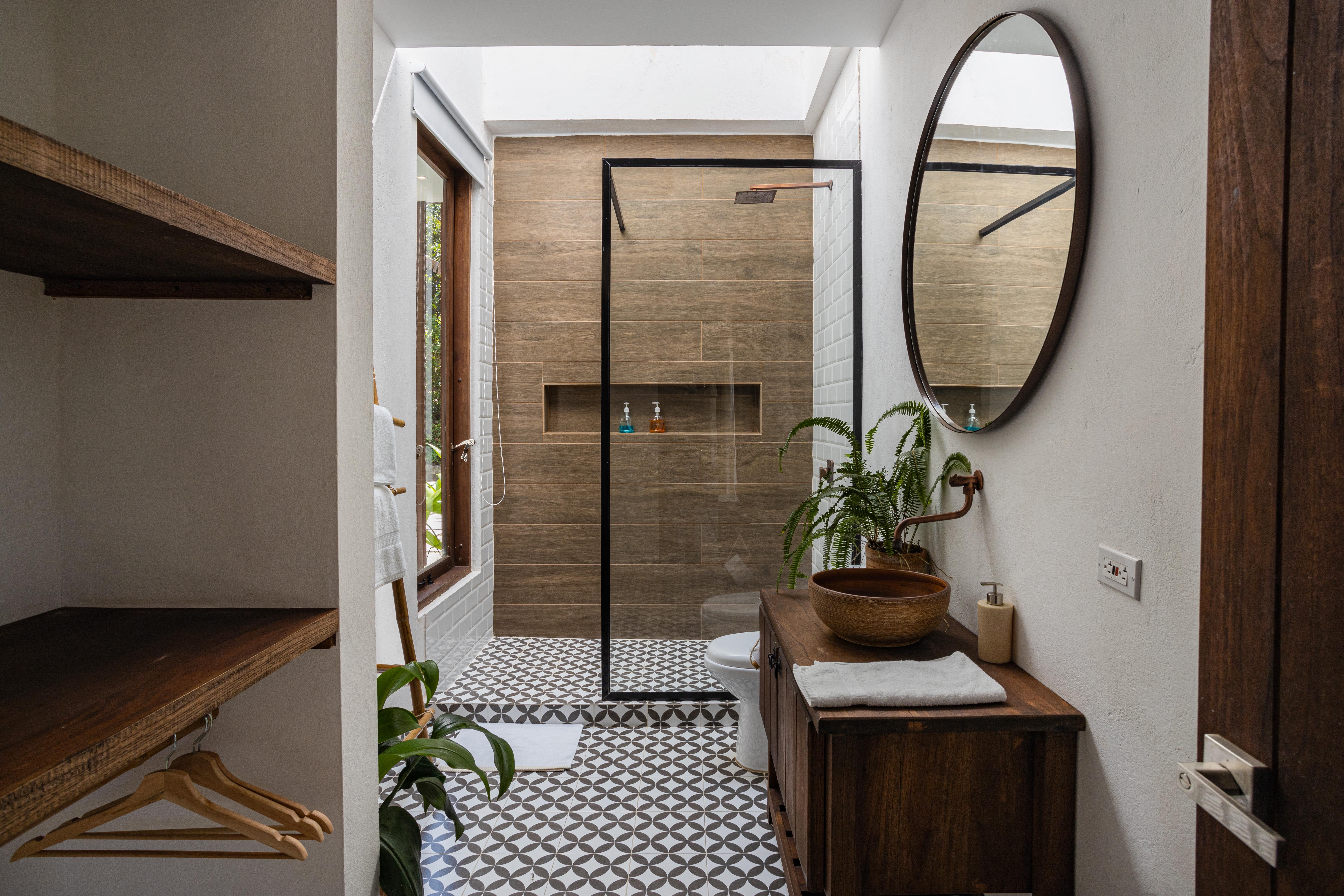 White And Brown Bathroom With Couple Of Indoor Plants In The Bathroom