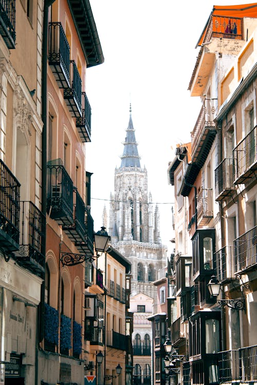 Toledo Cathedral Tower behind Buildings