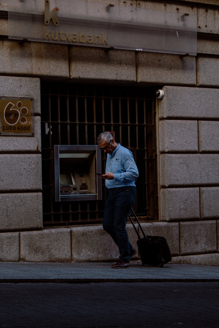 Man Walking With A Suitcase 