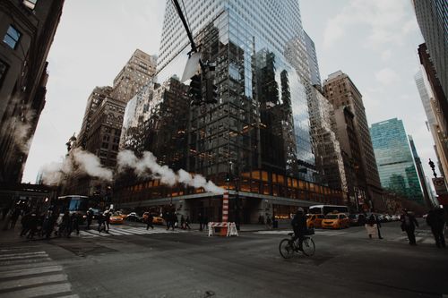 Free View of a busy intersection in New York City with skyscrapers and traffic. Stock Photo