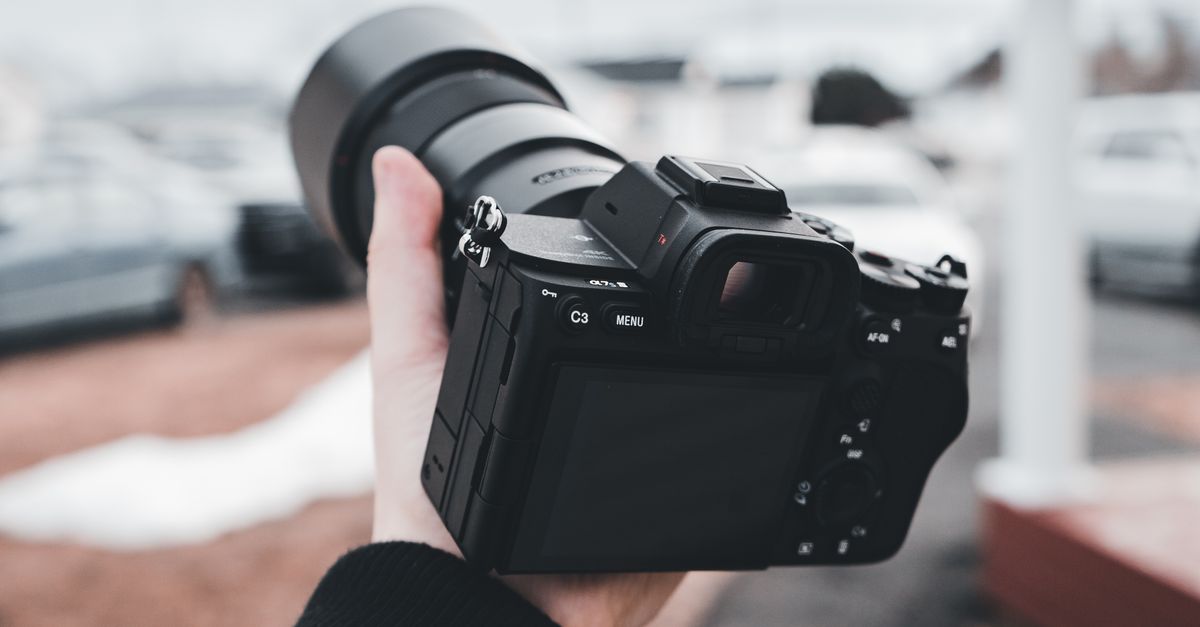 Camera In Use Hand Holding Camera · Free Stock Photo