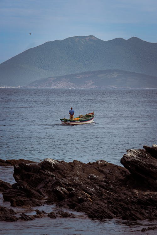 Fisherman on Boat on Sea