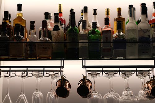 Shelf with a Selection of Alcohols and a Dryer for Glasses