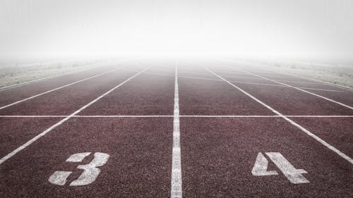 Free Brown and White Track Field Stock Photo