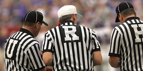 Free 3 Referees Standing on Field Stock Photo