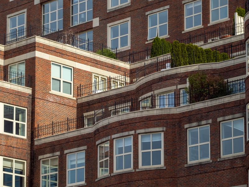 Red brick commercial building with terraces