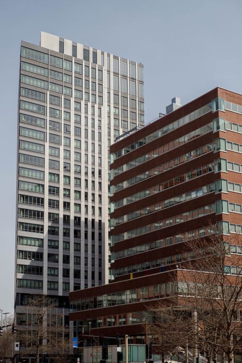 Free Tall buildings against a clear blue sky in an urban setting. Stock Photo