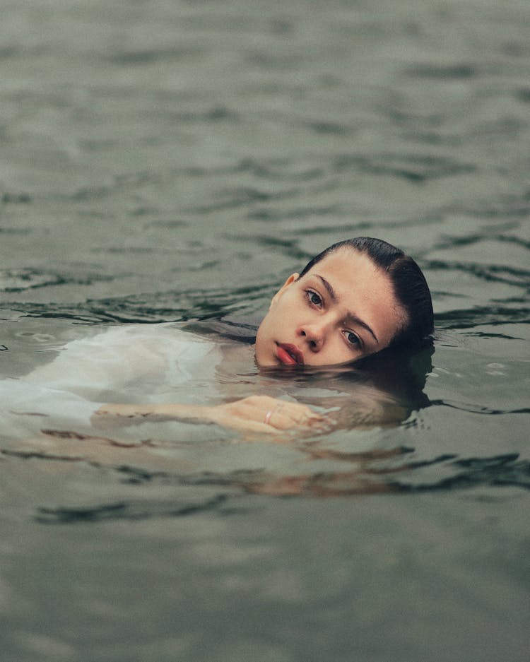 Woman Floating In Water