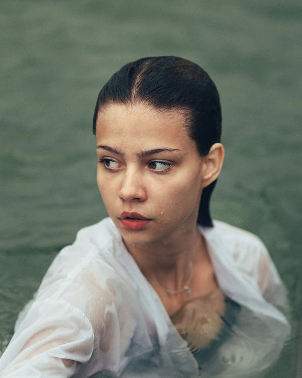 Woman in Shirt Posing in Water