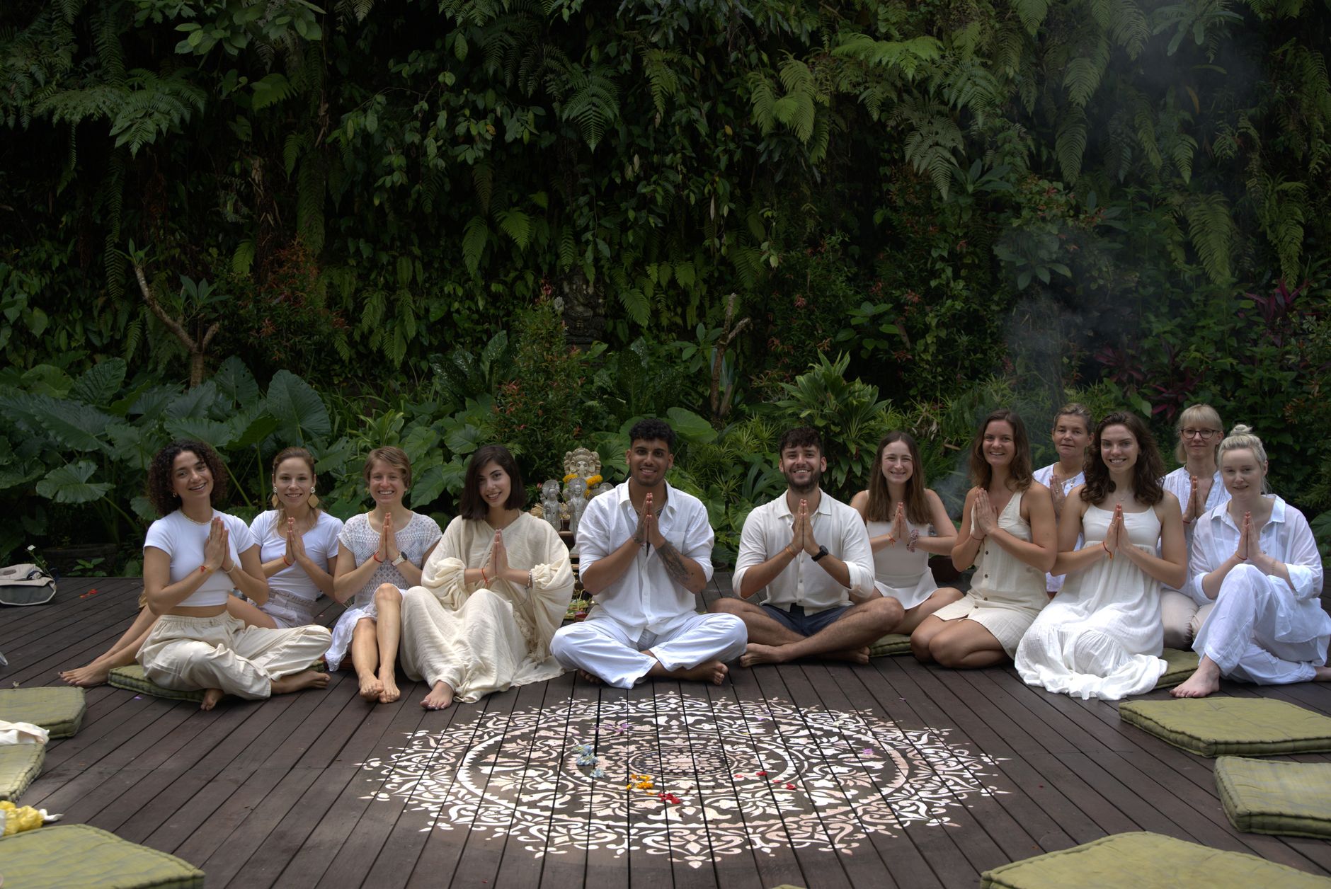 A diverse group practicing yoga outdoors, fostering unity and relaxation in nature.
