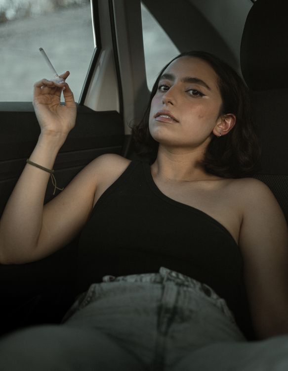 woman smoking cigarette in car A a a photo Free Dark Image on Unsplash Woman Lying Down with Cigarette