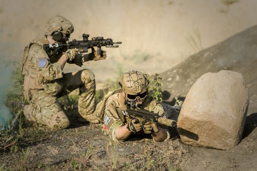 Military Sniping Near Rock