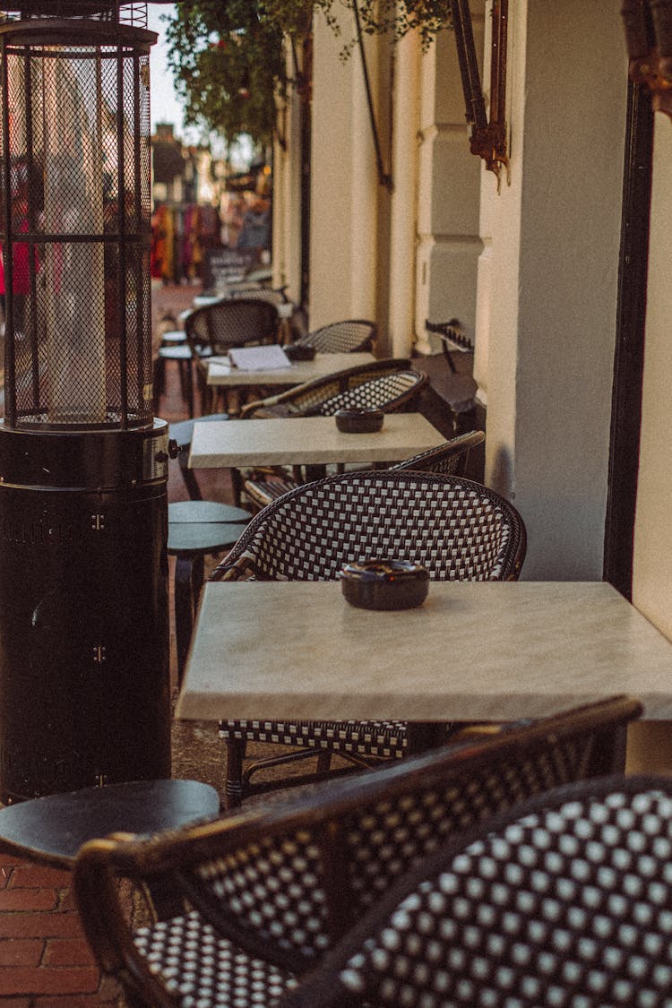 Empty Chairs And Tables Of Cafe