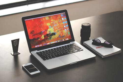 Free Macbook Pro on Top of Table Stock Photo