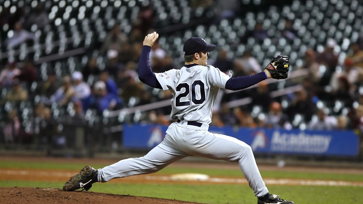 Baseball pitcher throwing during a game