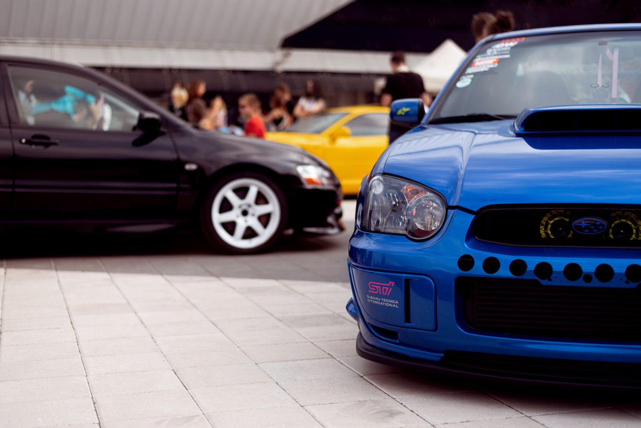 vibrant sports cars showcased at a lively outdoor automotive event