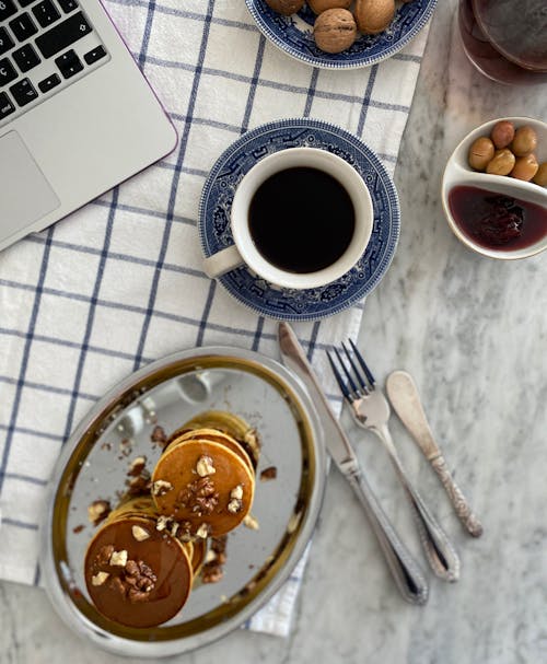 Pancakes and Coffee Cup for Breakfast on Table