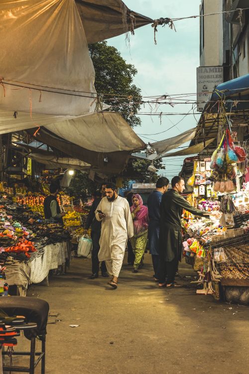 Free Vibrant street market scene with shoppers exploring stalls in Casablanca during the day. Stock Photo