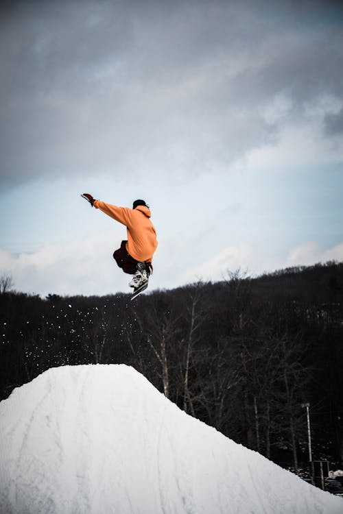 Free Person Snowboarding on Snow Mountain Stock Photo