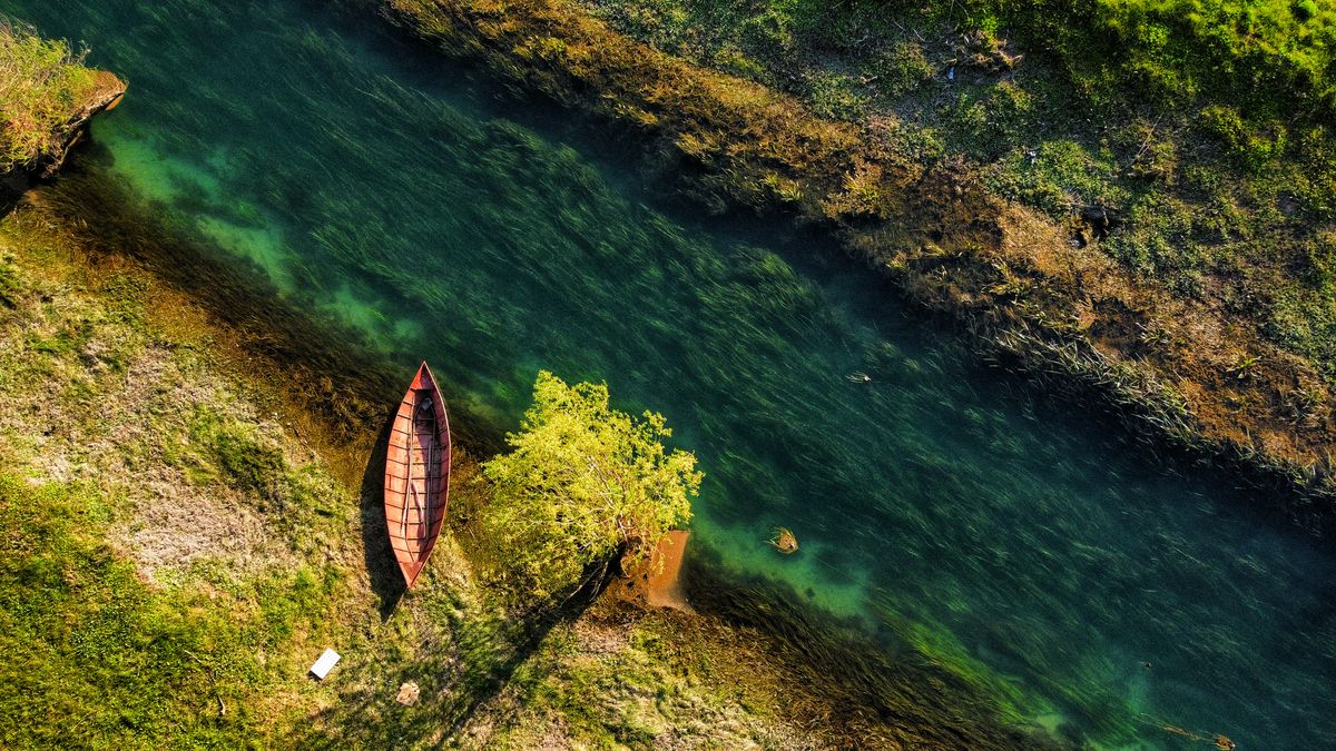 Aerial Photography of a Boat on the River · Free Stock Photo