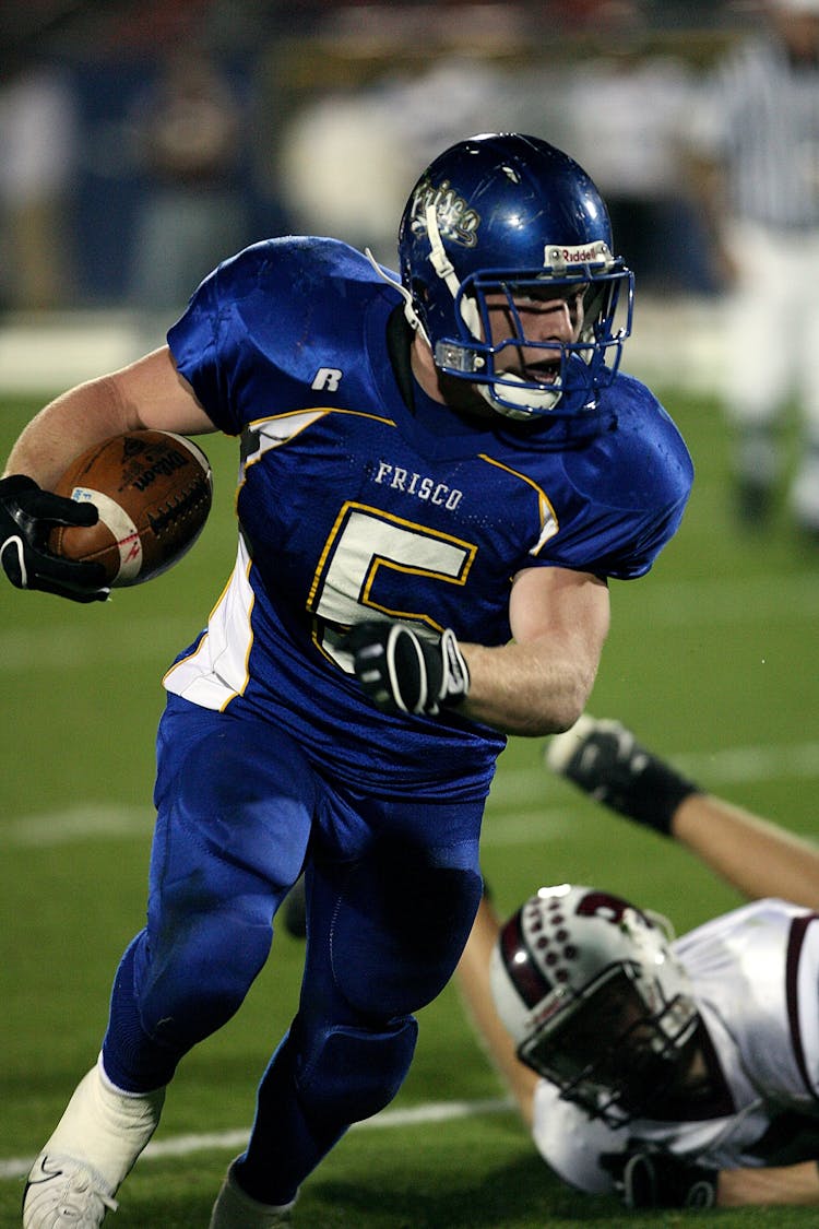 American Football Player In Blue Jersey