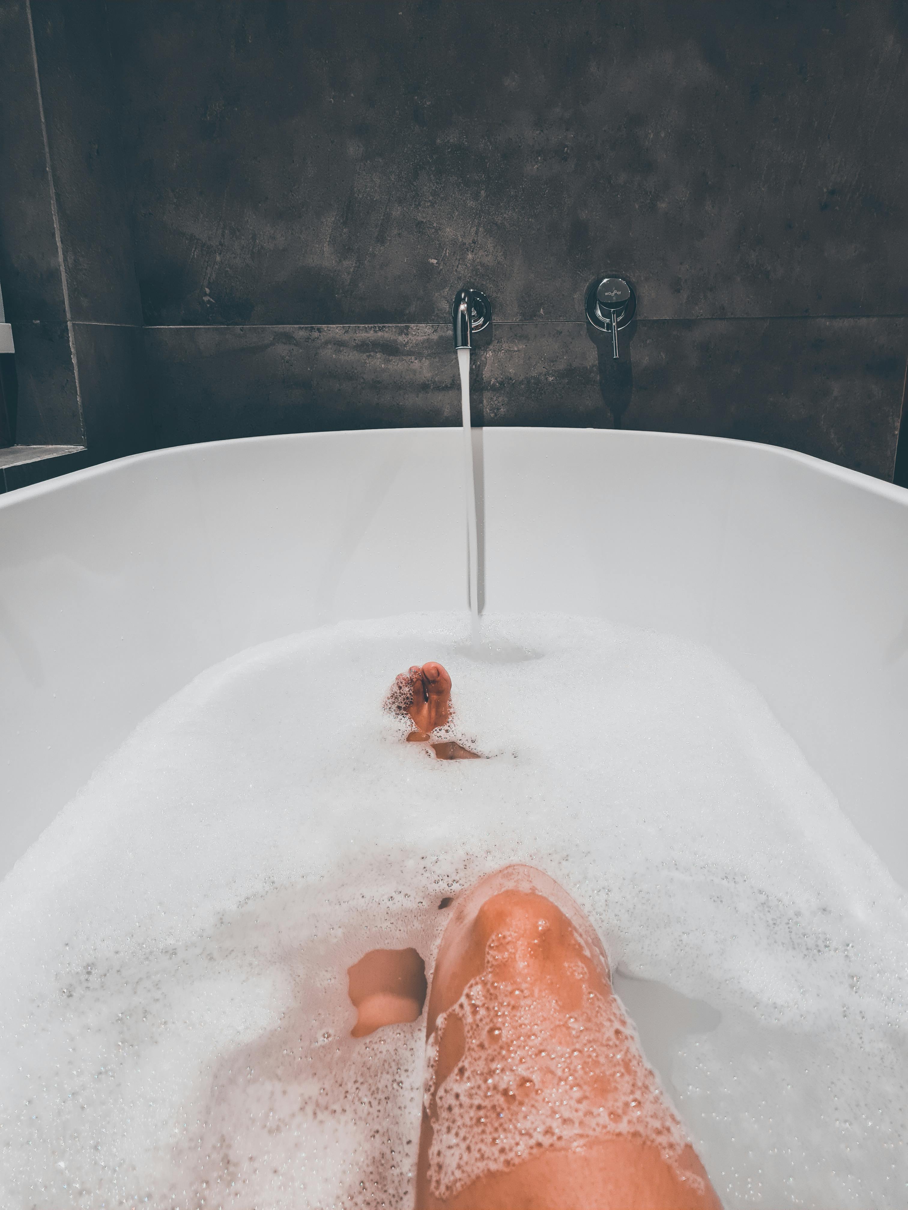 Legs of Woman Taking Bath · Free Stock Photo