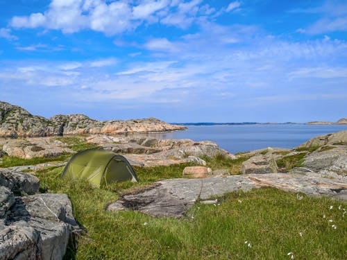 Tent among Rocks on Sea Coast