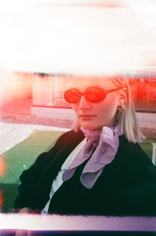 Woman Wearing Sunglasses and Scarf