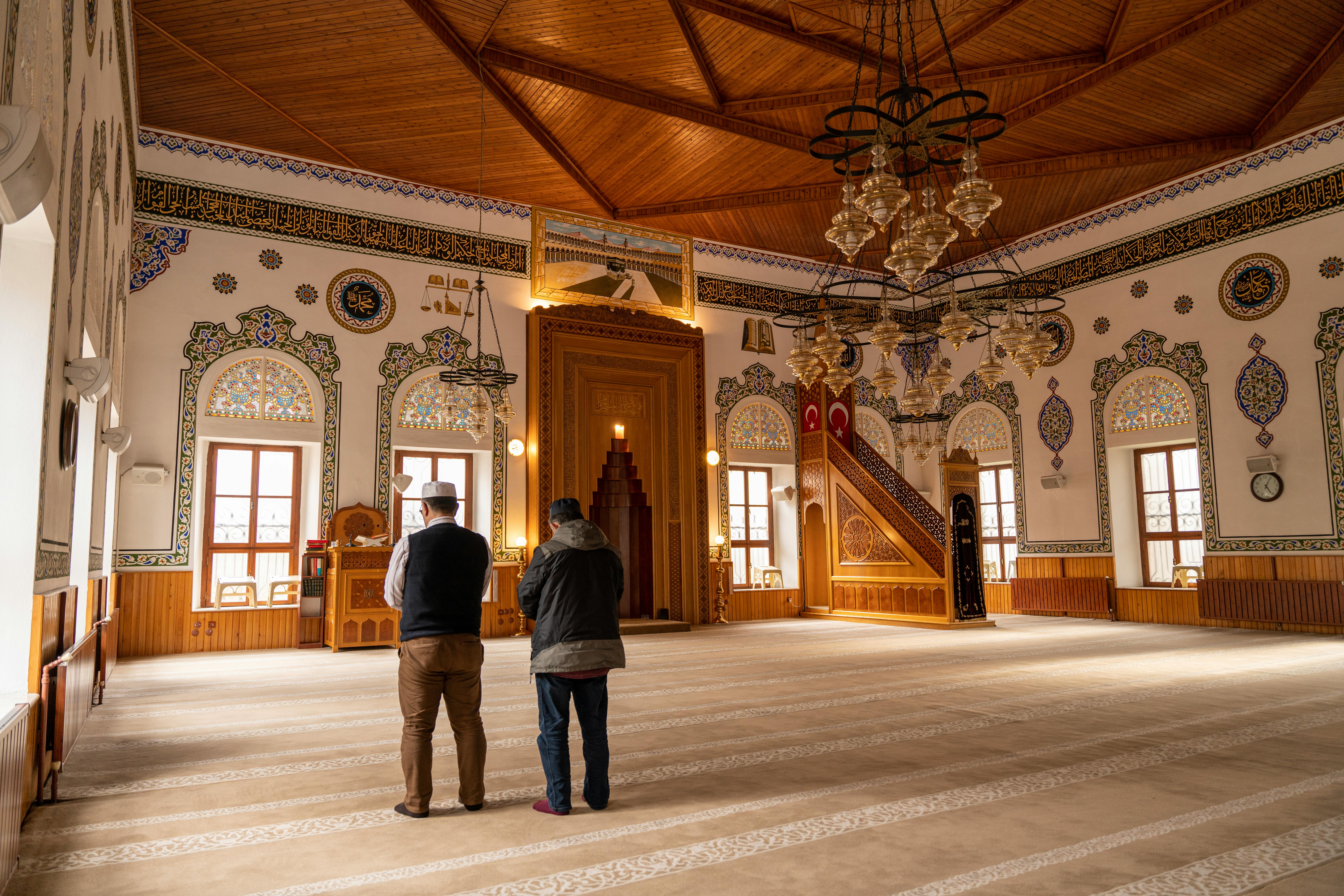 Free Men Praying in Traditional Mosque Stock Photo