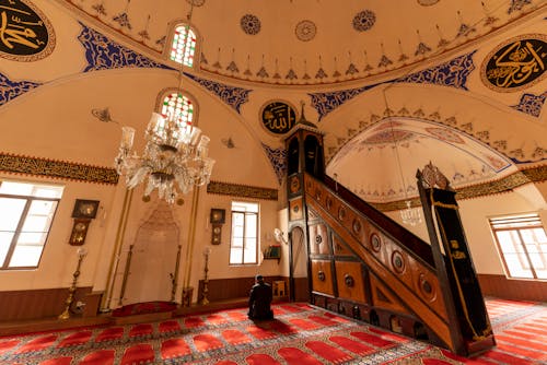 Man Praying in Ornate Traditional Mosque