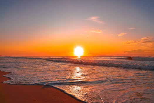 A breathtaking sunset over a calm ocean, perfect for serene landscape lovers.