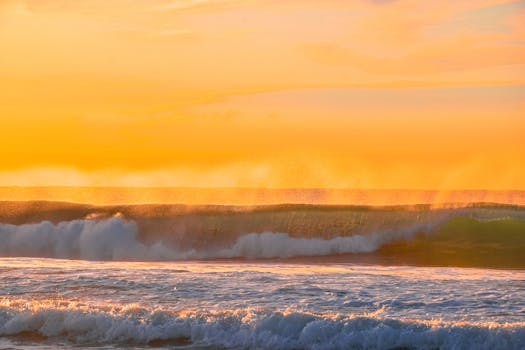 Vibrant sunset over ocean waves, capturing the beauty of nature.