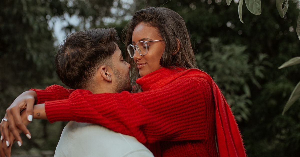 Hugging Sweater Man Hugging Woman in Red Sweater · Free Stock Photo