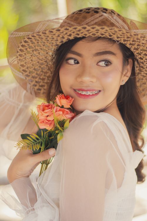 Portrait of a Woman Wearing a Straw Hat · Free Stock Photo