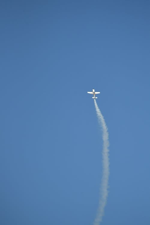 Low Angle Shot of an Airplane on the Background of a Blue Sky 