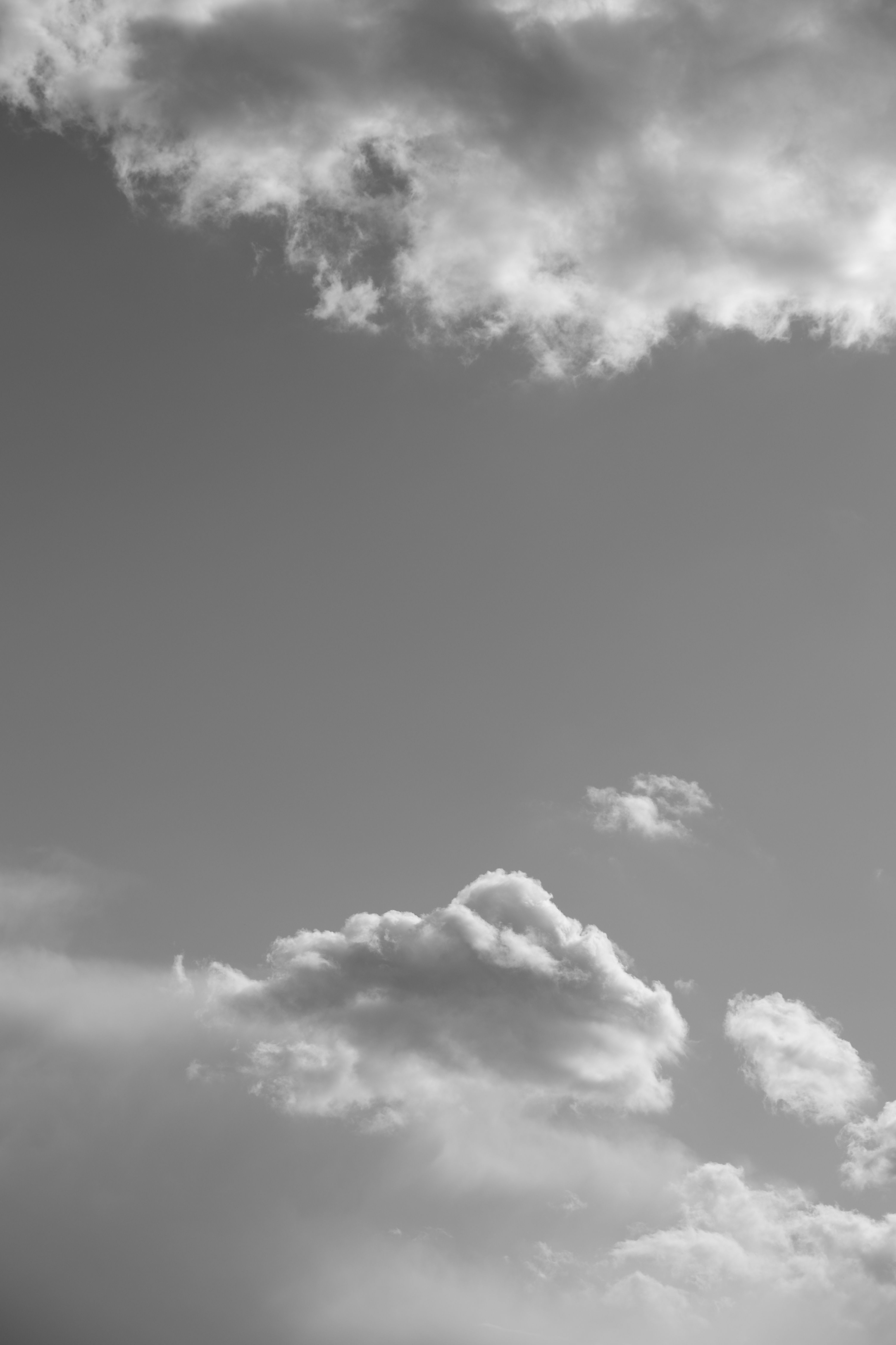 Black and White Picture of a Sky with Clouds · Free Stock Photo