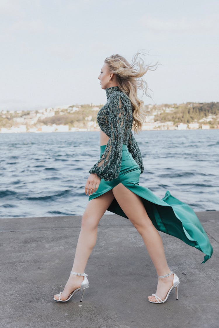 Blonde Walking In Pumps Along Sea