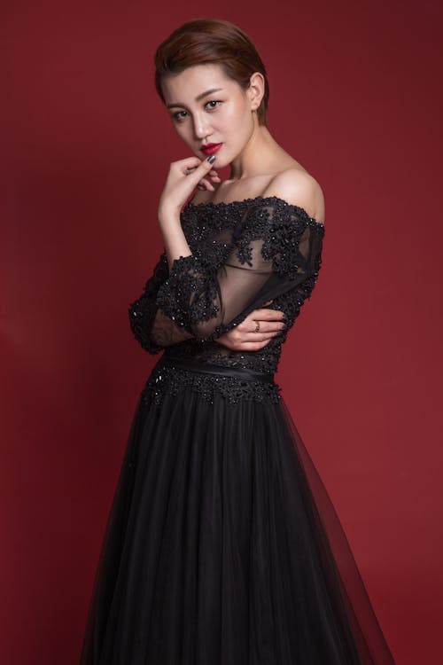 Free Woman in Black Strapless Dress Posing  Stock Photo