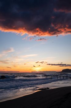 Stunning sunset at Kestel Beach in Antalya, with dramatic clouds and waves.