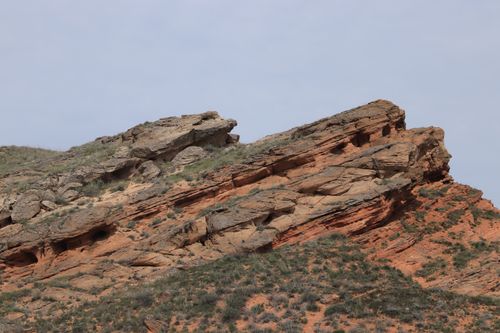 Free Stunning red sandstone rock formations showcasing unique geological structures against a clear sky. Stock Photo