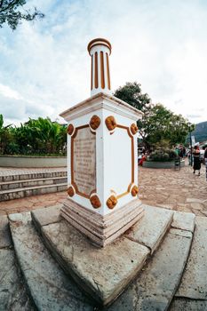 A prominent historic monument in Tiradentes, Brazil, surrounded by scenic views.