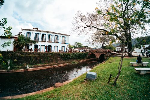 Free Explore colonial architecture by a scenic river in Tiradentes, Brazil. Stock Photo