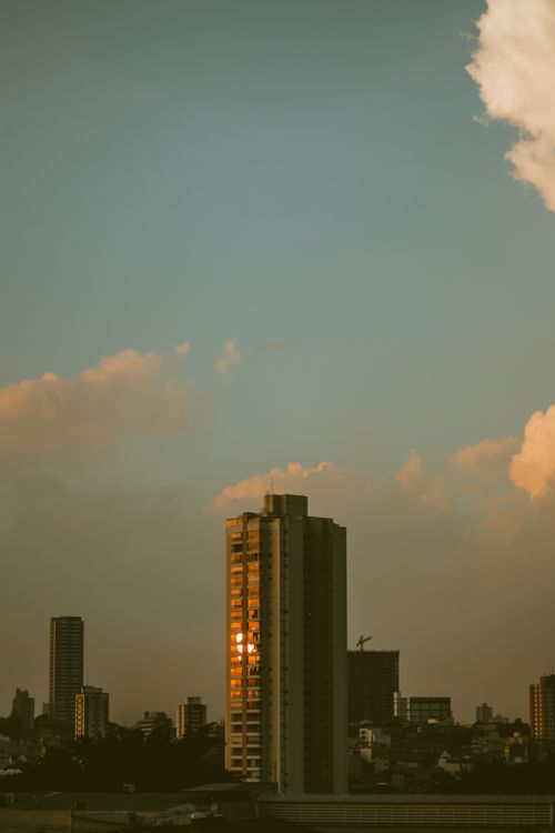 Free Captivating view of city skyscrapers at sunset with modern architecture. Stock Photo